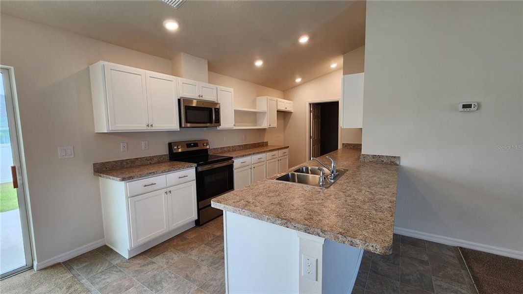Furnished interior view inside a new home in , Dunnellon (Image 5).