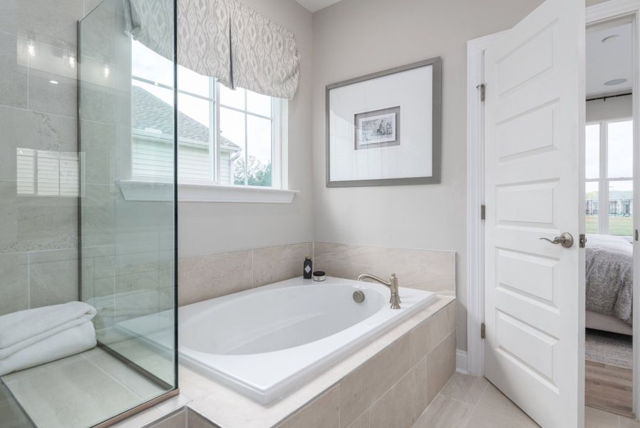 Owner's spa bath with freestanding soaking tub