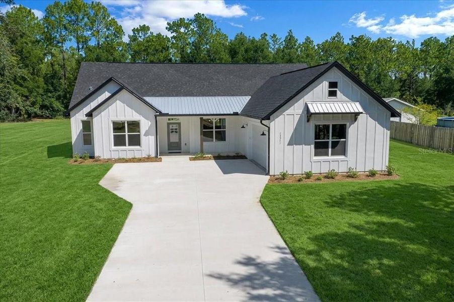 Front exterior of a new home in , Ocala, FL, highlighting curb appeal (Image 25). Front exterior of a new home in , Ocala, FL, highlighting curb appeal (Image 25).