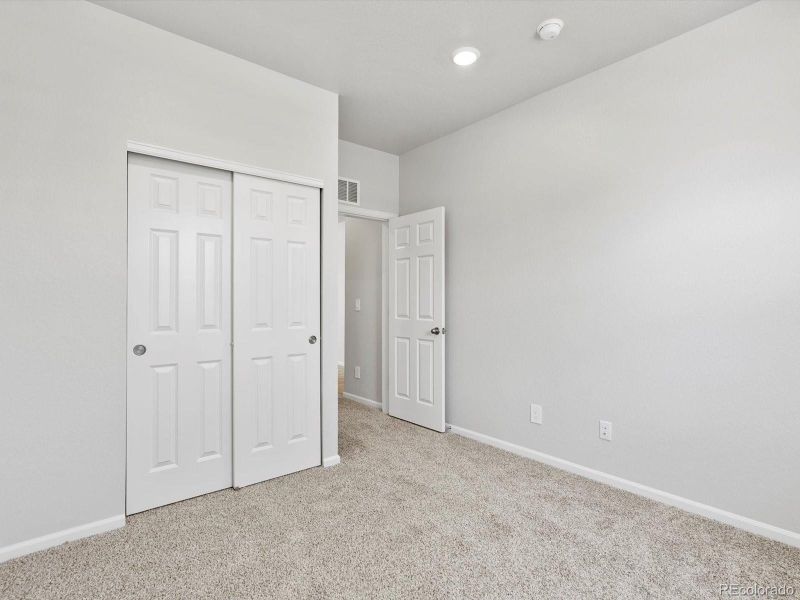 Spacious, unfurnished interior of a new home in Ridgeline Vista: The Canyon Collection, Brighton (Image 15).