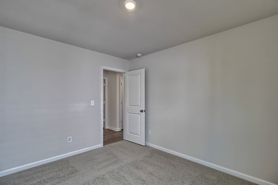 Representative unfurnished interior of a home built from the Juniper by McGuinn Homes in Hunters Branch, Hopkins (Image 16).