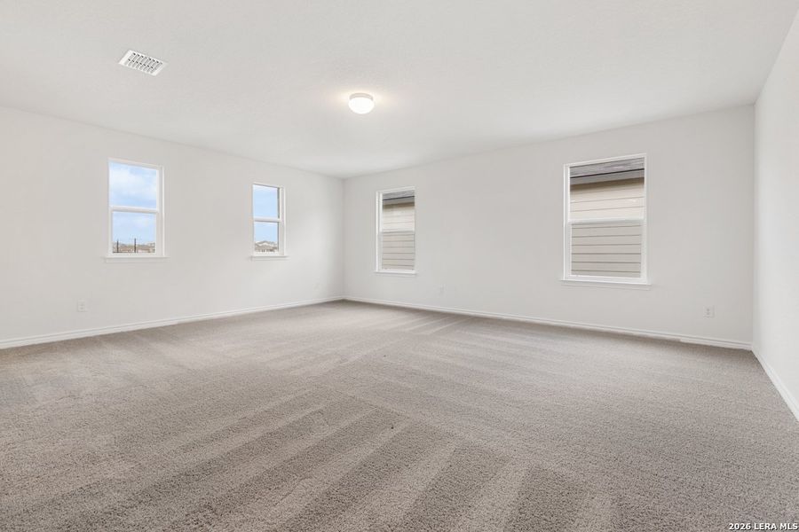 Spacious, unfurnished interior of a new home in Hidden Bluffs at TRP, San Antonio (Image 26).