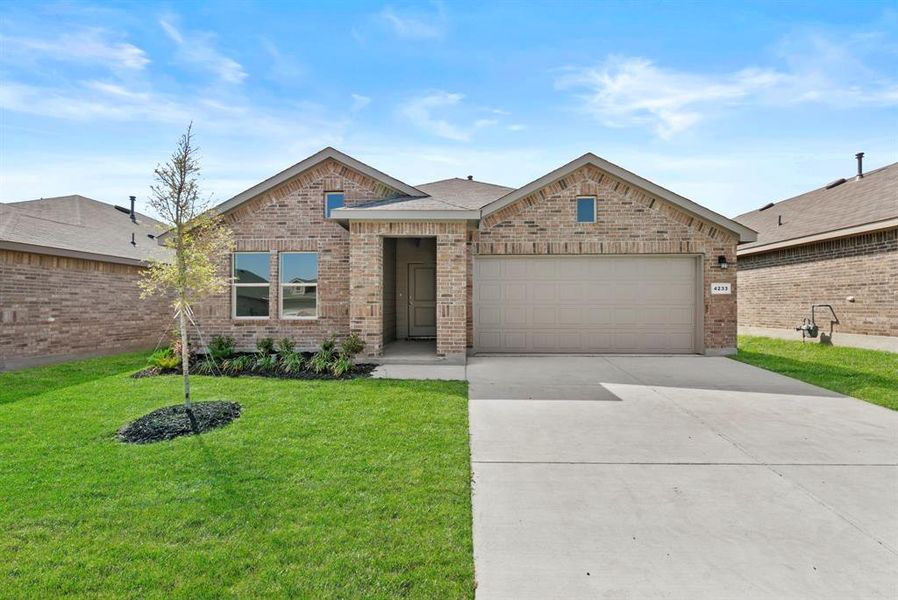 Front exterior of a new home in Sunnycreek, Crowley, TX, highlighting curb appeal (Image 2).