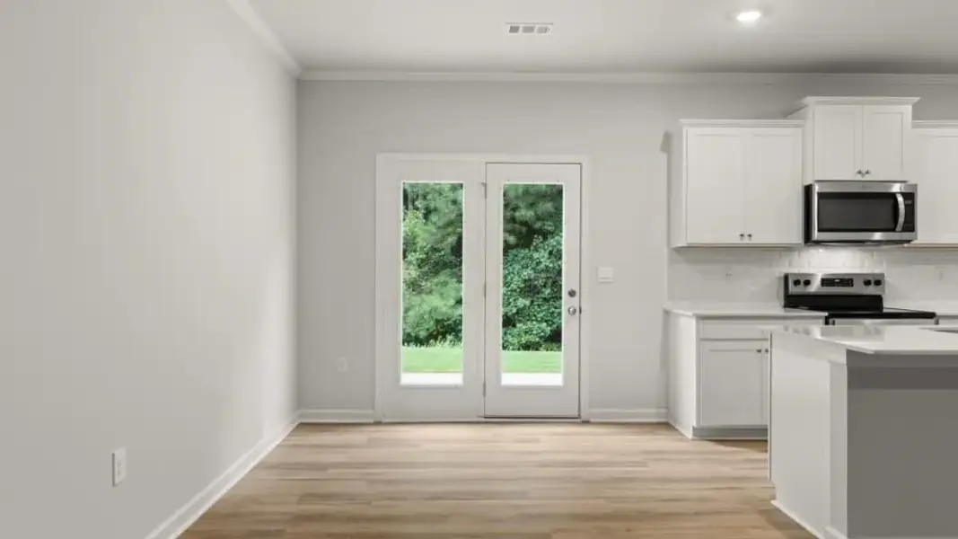 Spacious, unfurnished interior of a new home in Waypoint, Flowery Branch (Image 12).