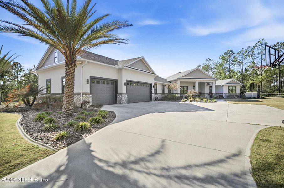 Front exterior of a new home in , Palm Coast, FL, highlighting curb appeal (Image 2). Front exterior of a new home in , Palm Coast, FL, highlighting curb appeal (Image 2).