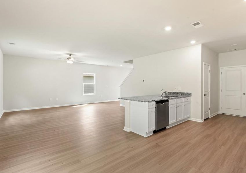 Open floor plan with a large living room and a kitchen.