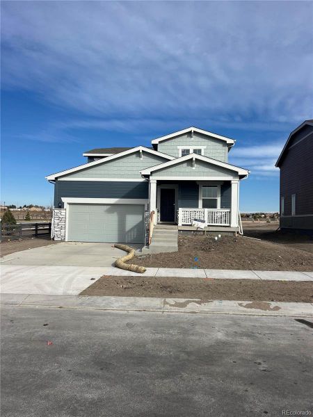 Front exterior of a new home in , Colorado Springs, CO, highlighting curb appeal (Image 1).