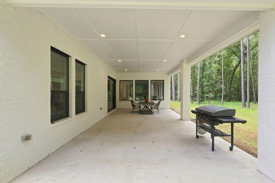 Exterior details and patio area of a home in , New Waverly (Image 24).