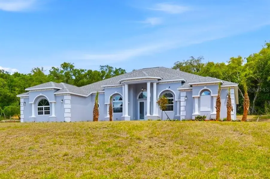 Front exterior of a new home in , Hernando, FL, highlighting curb appeal (Image 30).