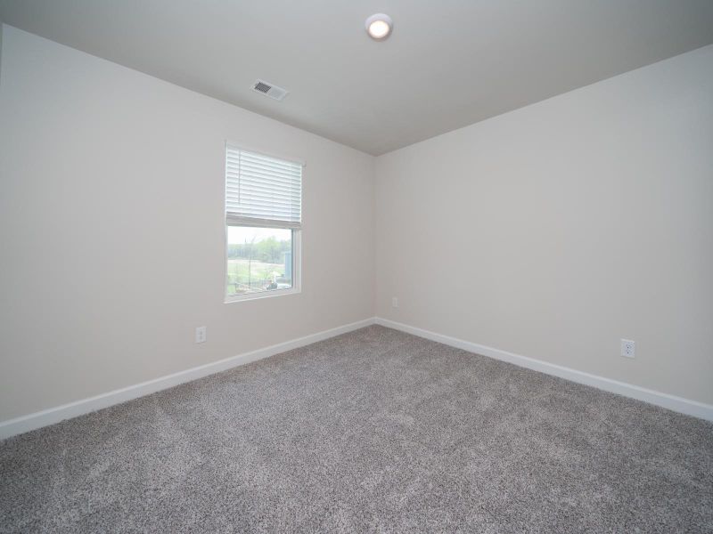 Guest Bedroom in the Roswell at Childers Park.