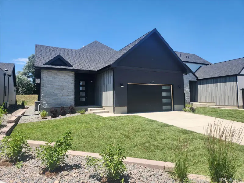 Front exterior of a new home in Pelican Shores at Water Valley, Windsor, CO, highlighting curb appeal (Image 2).