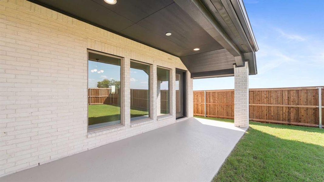 Exterior details and patio area of a home in Trinity Falls 50', McKinney (Image 2).