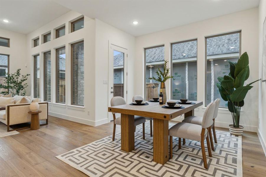 Dining space with light wood-type flooring