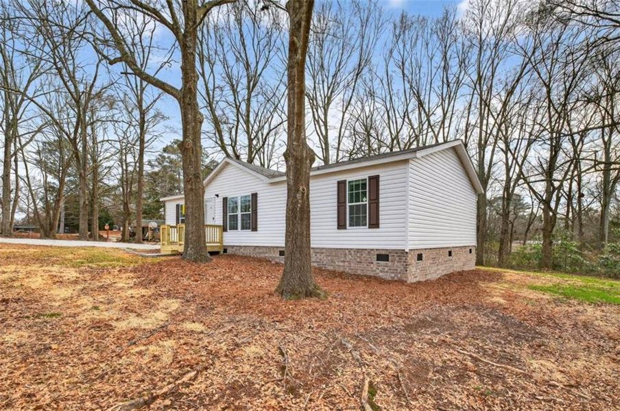 Exterior details and patio area of a home in , Loganville (Image 26).