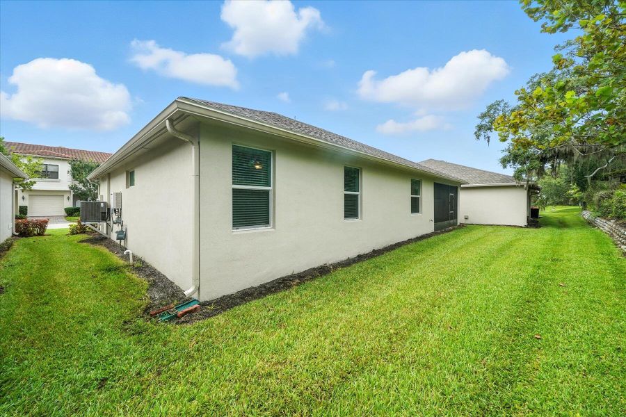 Front exterior of a new home in Bella Rosa, Vero Beach, FL, highlighting curb appeal (Image 23). Front exterior of a new home in Bella Rosa, Vero Beach, FL, highlighting curb appeal (Image 23).