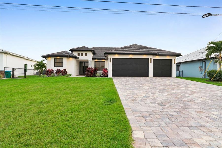 Front exterior of a new home in , Cape Coral, FL, highlighting curb appeal (Image 26).