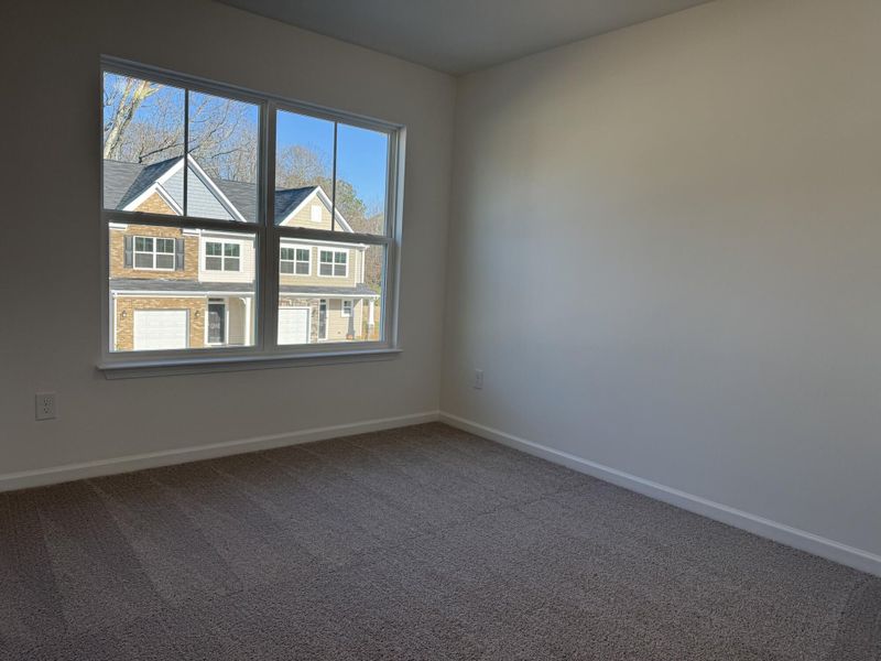 Spacious, unfurnished interior of a new home in East Main Townes, Spartanburg (Image 16).