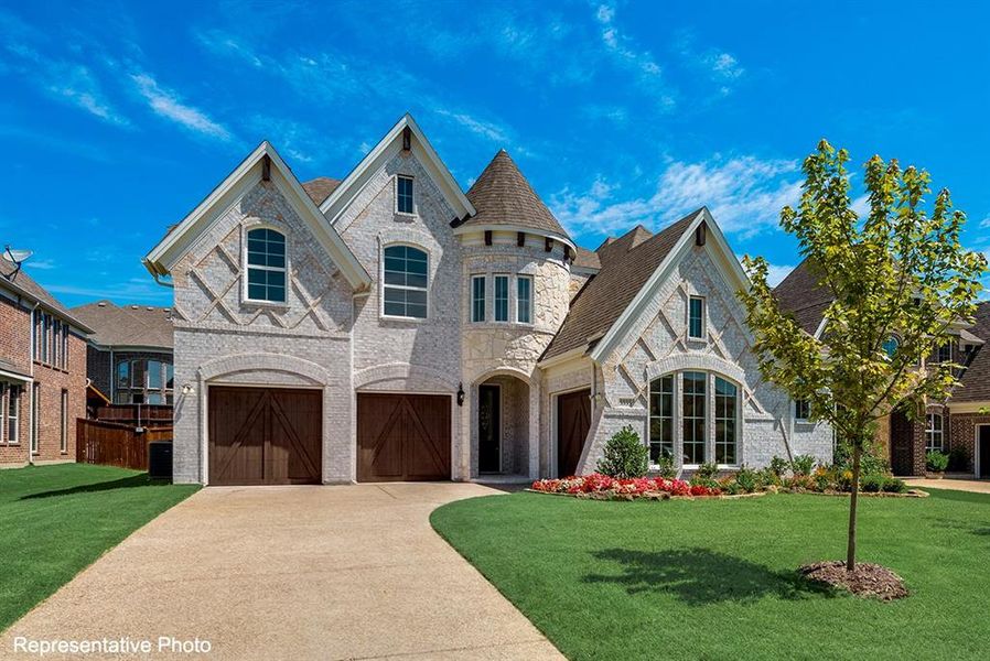 Front exterior of a new home in Cedar Ridge Estates, Grand Prairie, TX, highlighting curb appeal (Image 1).
