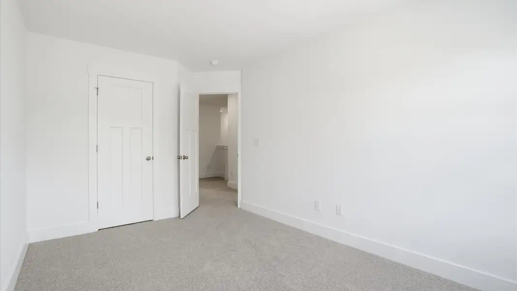 Highly functional bedroom with large windows, carpeted flooring, and tasteful finishes throughout located at Marion Square