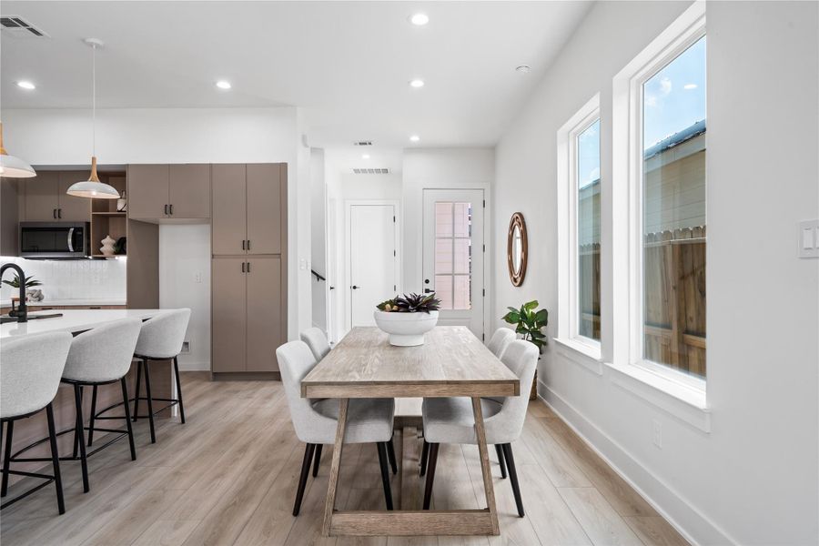 The thoughtfully designed dining area comfortably seats 6–8, making it perfect for family meals and entertaining guests. Its open connection to the kitchen and living space ensures everyone feels included, whether hosting a dinner party or enjoying everyday moments. Warm finishes and inviting proportions create a space where memories are meant to be made.