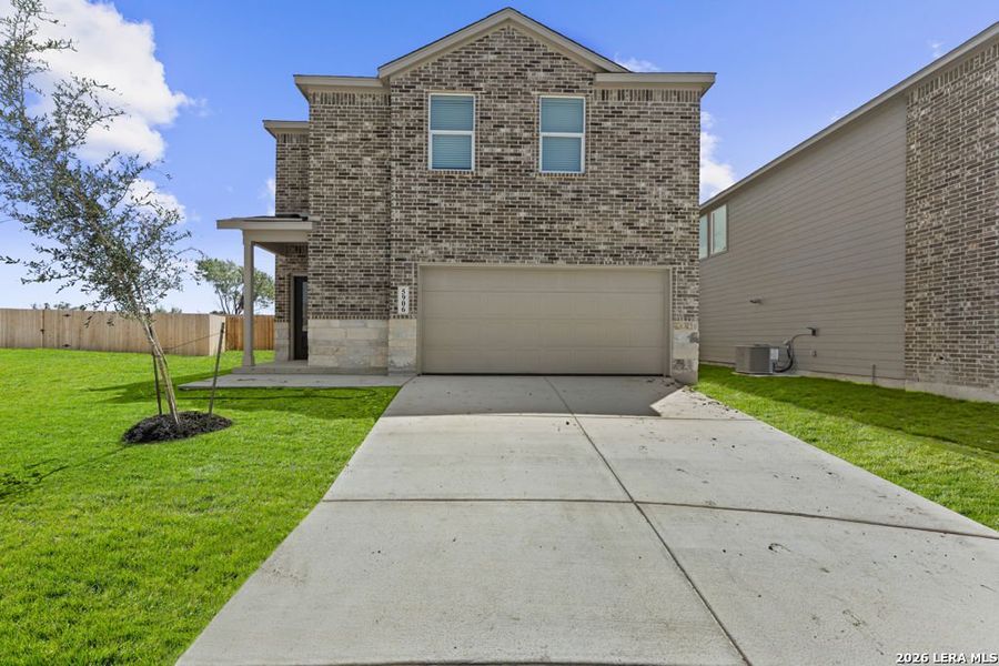 Front exterior of a new home in Stone Garden, San Antonio, TX, highlighting curb appeal (Image 1). Front exterior of a new home in Stone Garden, San Antonio, TX, highlighting curb appeal (Image 1).