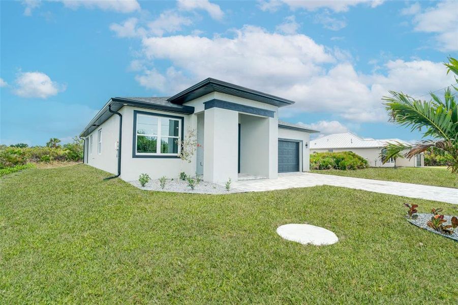 Front exterior of a new home in , Rotonda West, FL, highlighting curb appeal (Image 30).