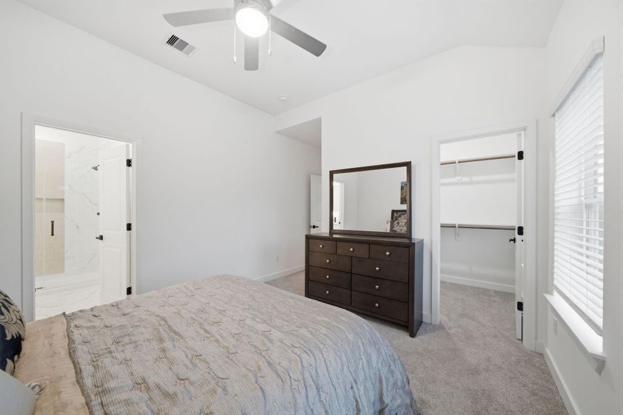 Primary bedroom includes a walk-in closet. Primary bedroom includes a walk-in closet.