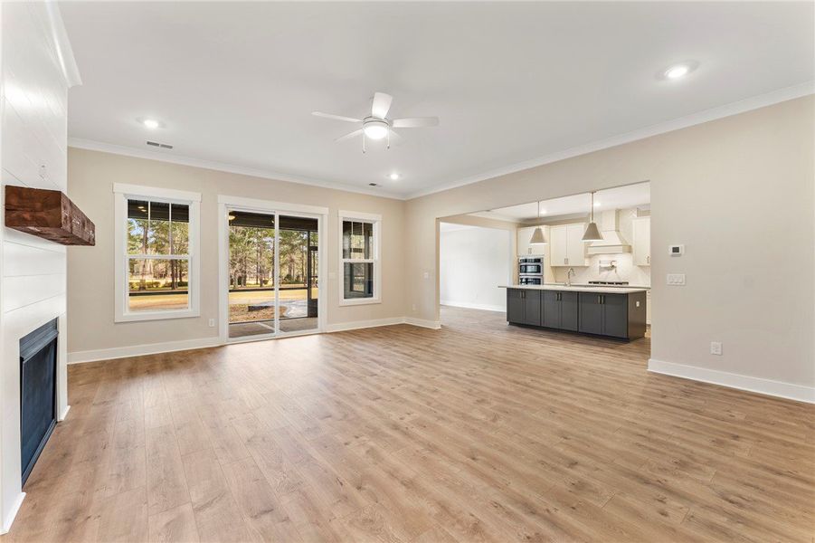 This kitchen showcases a central island and contem