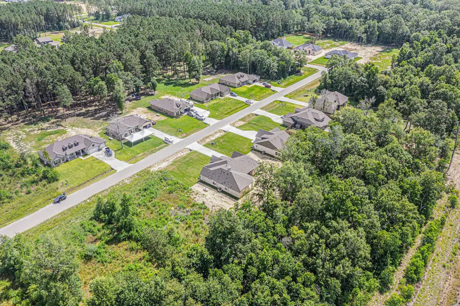 Aerial view of the Little River Ranch community in Bay City, TX, showing layout and nearby surroundings (Image 1). Aerial view of the Little River Ranch community in Bay City, TX, showing layout and nearby surroundings (Image 1).
