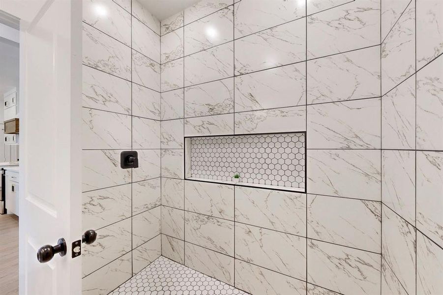 Bathroom with tiled shower