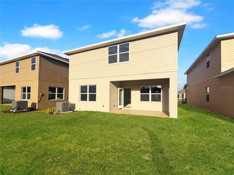 Exterior details and patio area of a home in Harmony Central, St. Cloud (Image 3).