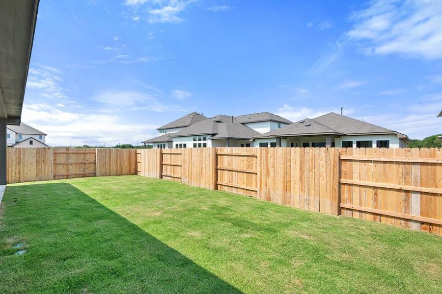 Front exterior of a new home in Lagos Reserve, Manor, TX, highlighting curb appeal (Image 20). Front exterior of a new home in Lagos Reserve, Manor, TX, highlighting curb appeal (Image 20).