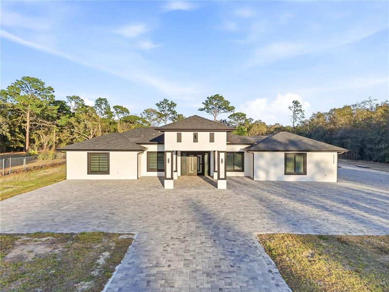 Front exterior of a new home in , Spring Hill, FL, highlighting curb appeal (Image 23).