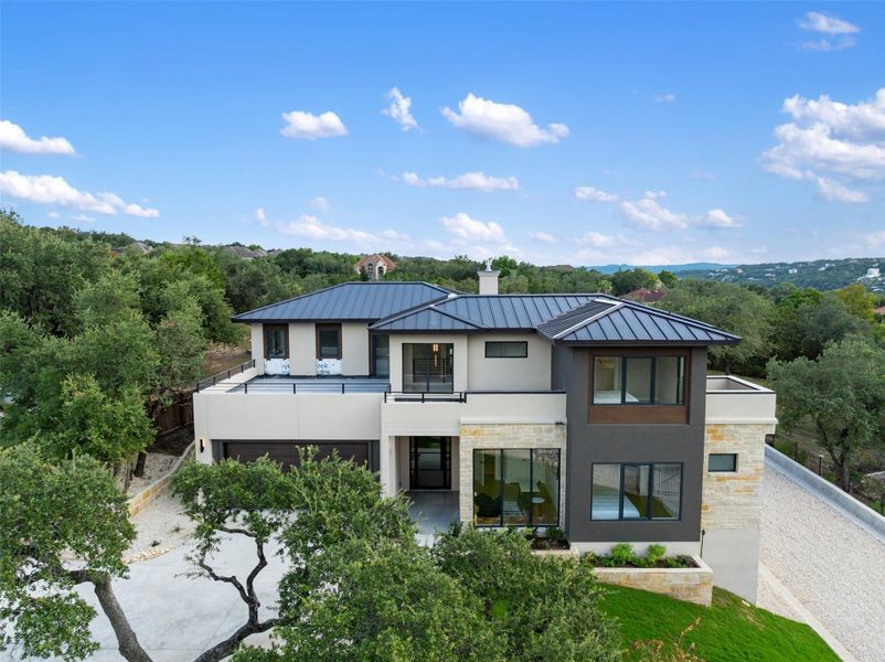 Modern home with metal roof. Modern home with metal roof.