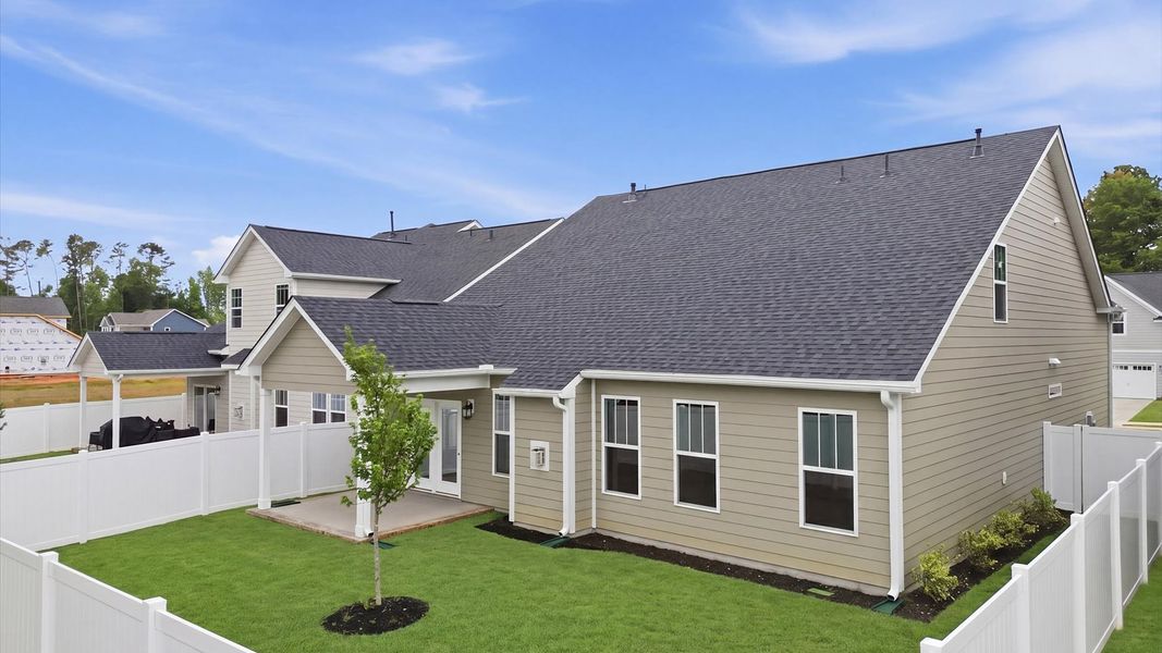 Exclusive rear covered porch with accomplished detail and elevated outdoor living potential at the Pelham Crossing community