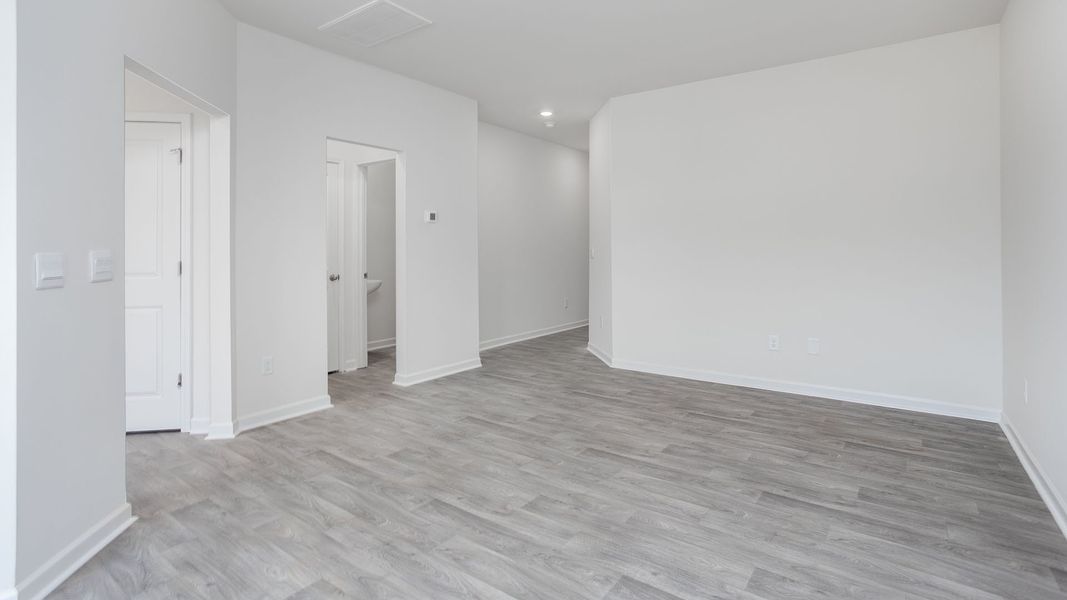 Spacious, unfurnished interior of a new home in The Gables at Edinborough Townes, Gibsonville (Image 12).