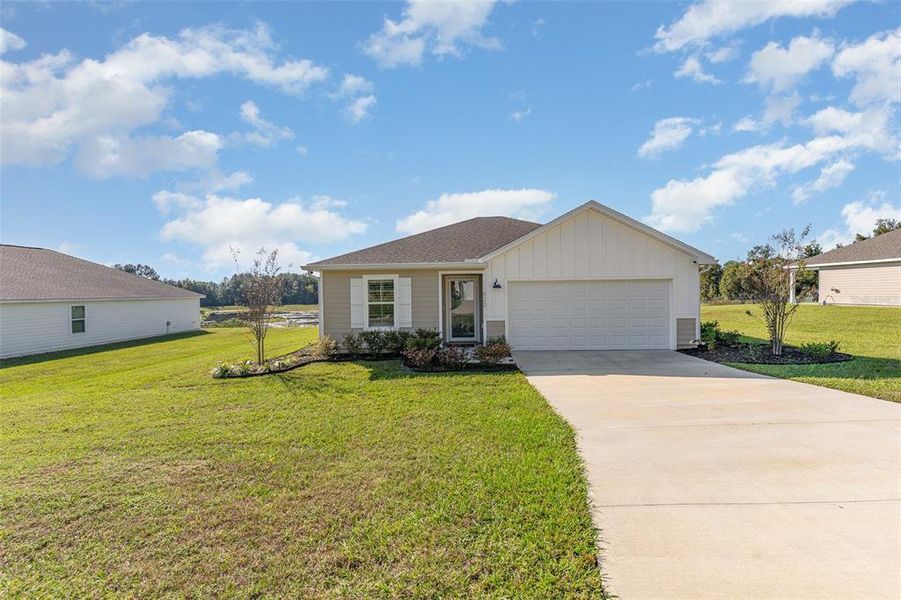 Front exterior of a new home in , Lake City, FL, highlighting curb appeal (Image 1).