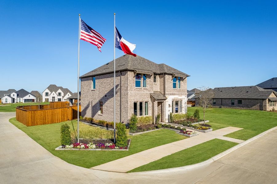 Front exterior of a new home in North Sky Celina, Celina, TX, highlighting curb appeal (Image 13). Front exterior of a new home in North Sky Celina, Celina, TX, highlighting curb appeal (Image 13).