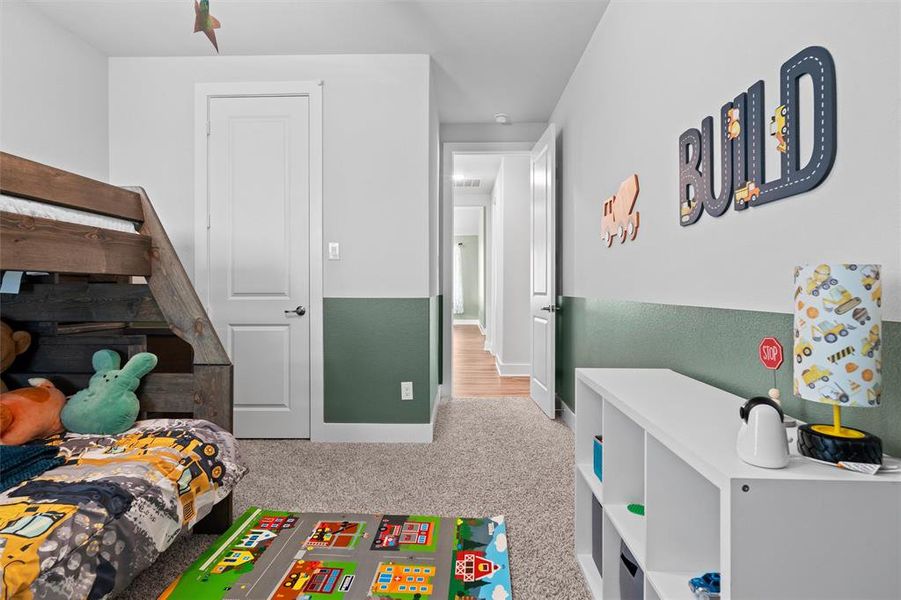 The secondary bedrooms are on the opposite side of the house from the primary suite, down a hallway.