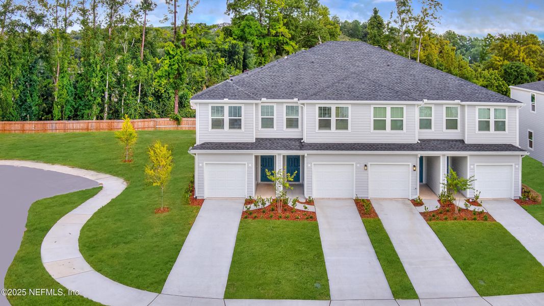 Front exterior of a new home in , Orange Park, FL, highlighting curb appeal (Image 1).