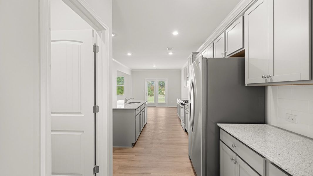 Representative furnished interior of a home built from the HALTON by D.R. Horton in Lost Creek, Dallas (Image 7).