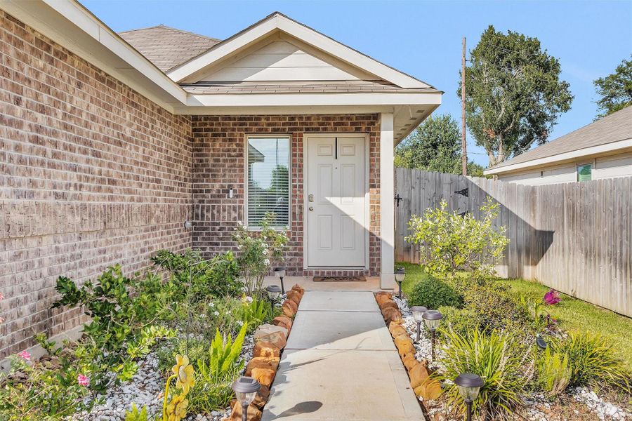 Front exterior of a new home in , Sealy, TX, highlighting curb appeal (Image 23). Front exterior of a new home in , Sealy, TX, highlighting curb appeal (Image 23).