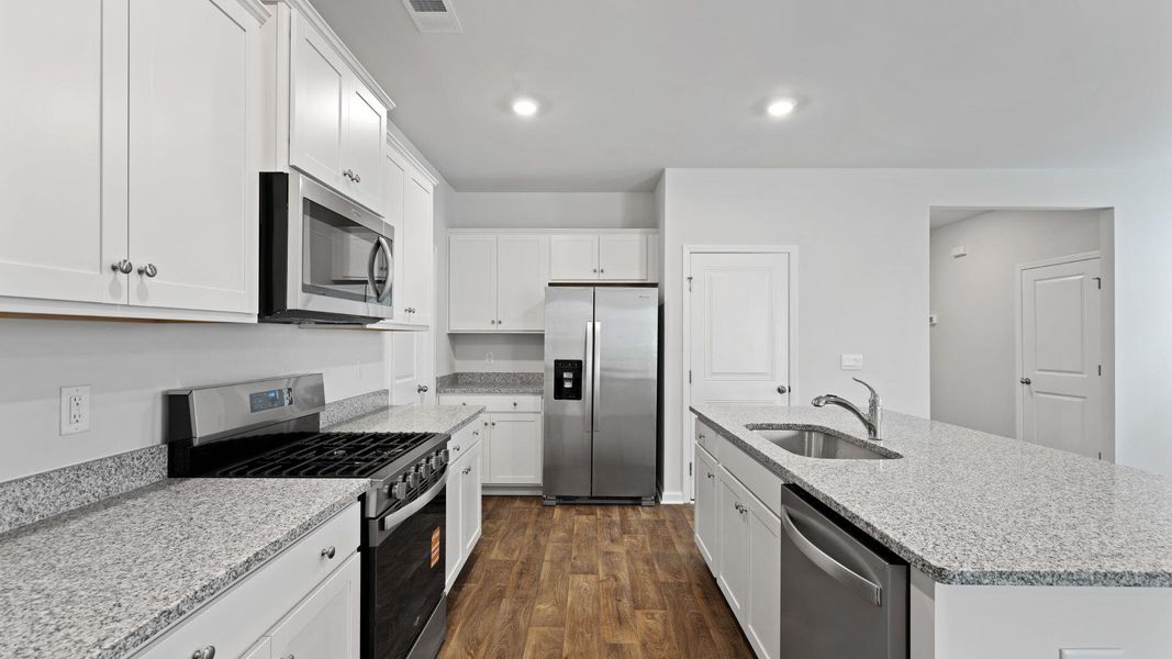 Furnished interior view inside a new home in Pine Hills at Cane Bay, Summerville (Image 9). Furnished interior view inside a new home in Pine Hills at Cane Bay, Summerville (Image 9).