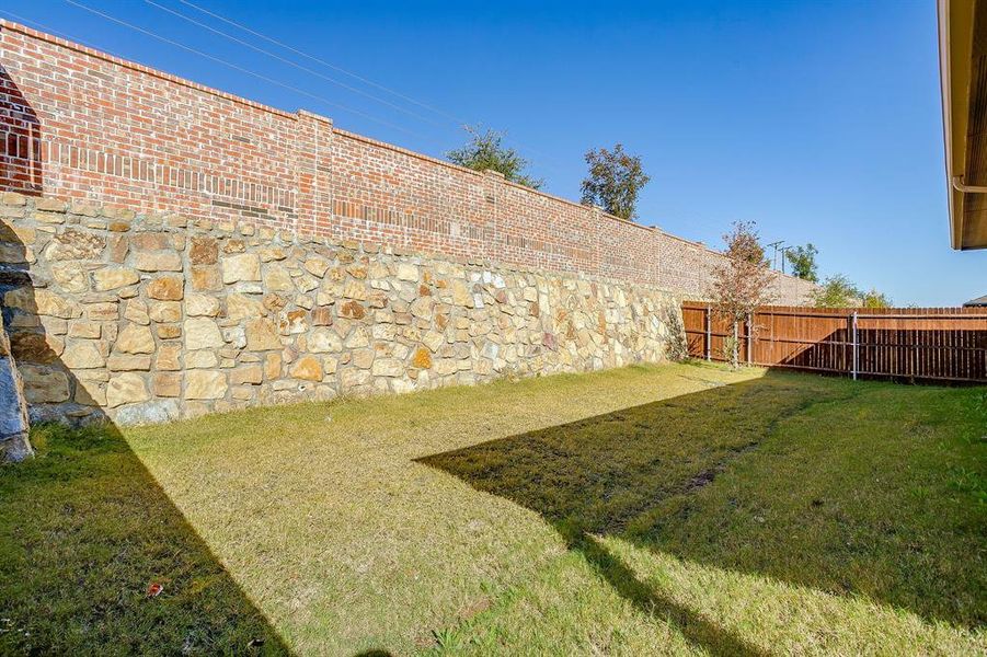 View of fenced backyard