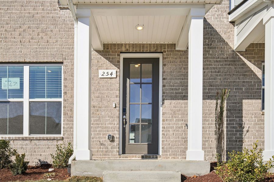Exterior details and patio area of a home in Greystone - Vista Townhomes, Smyrna (Image 3).