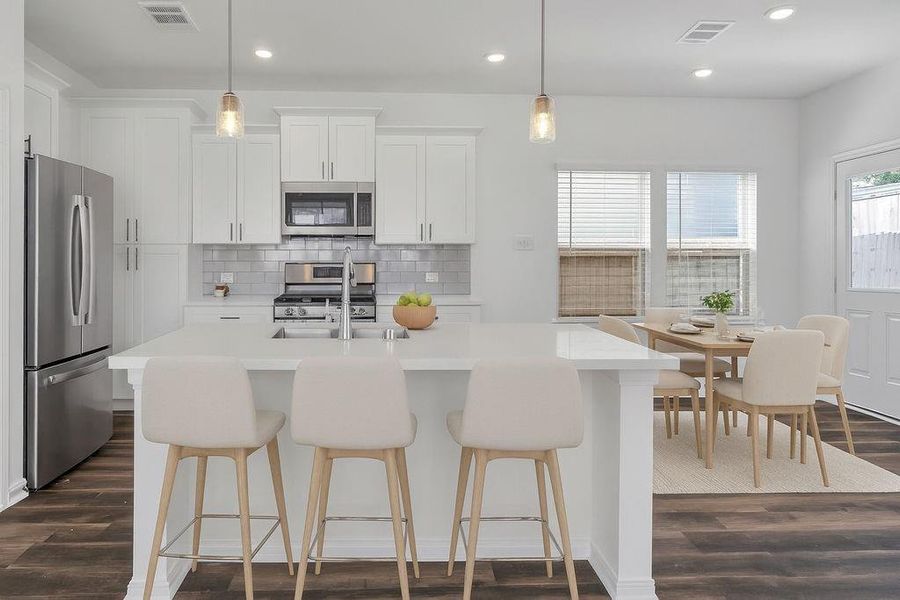 Modern kitchen and dining area, creating a bright and inviting space perfect for entertaining. Modern kitchen and dining area, creating a bright and inviting space perfect for entertaining.
