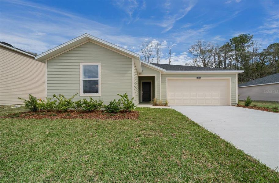Front exterior of a new home in Tara Forest East, Alachua, FL, highlighting curb appeal (Image 22).