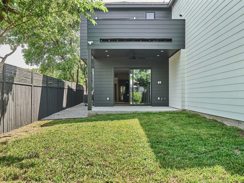 Rear view of house featuring a ceiling fan, a patio, and a fenced backyard Rear view of house featuring a ceiling fan, a patio, and a fenced backyard