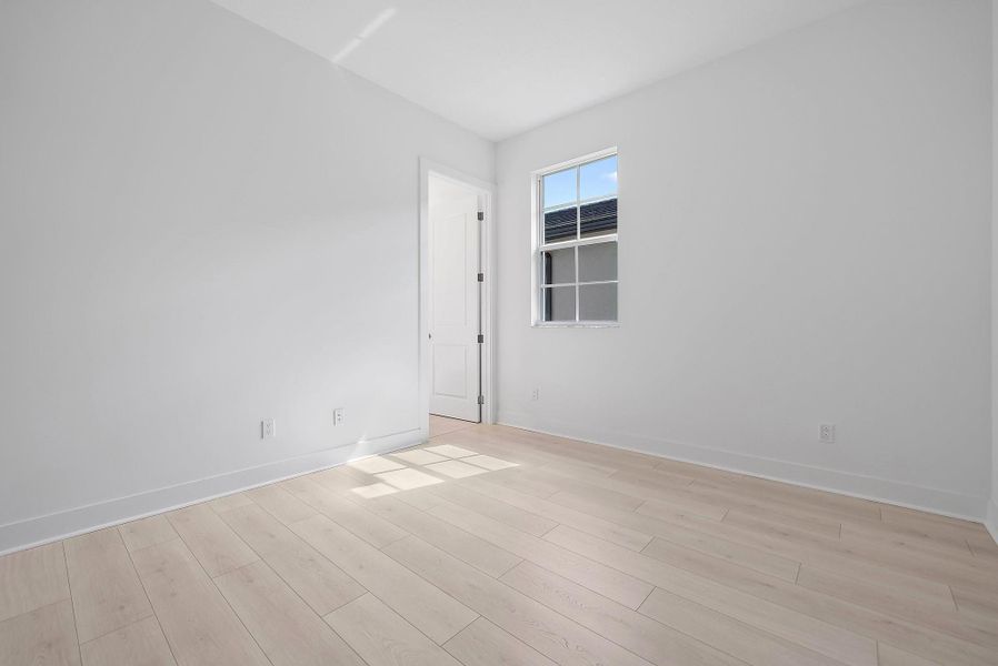 Spacious, unfurnished interior of a new home in L'Ambiance at Avenir, Palm Beach Gardens (Image 35).