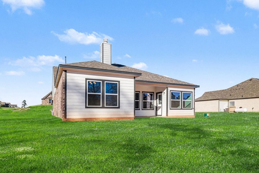 Exterior details and patio area of a home in Rose Hill Estates, Willis (Image 4).